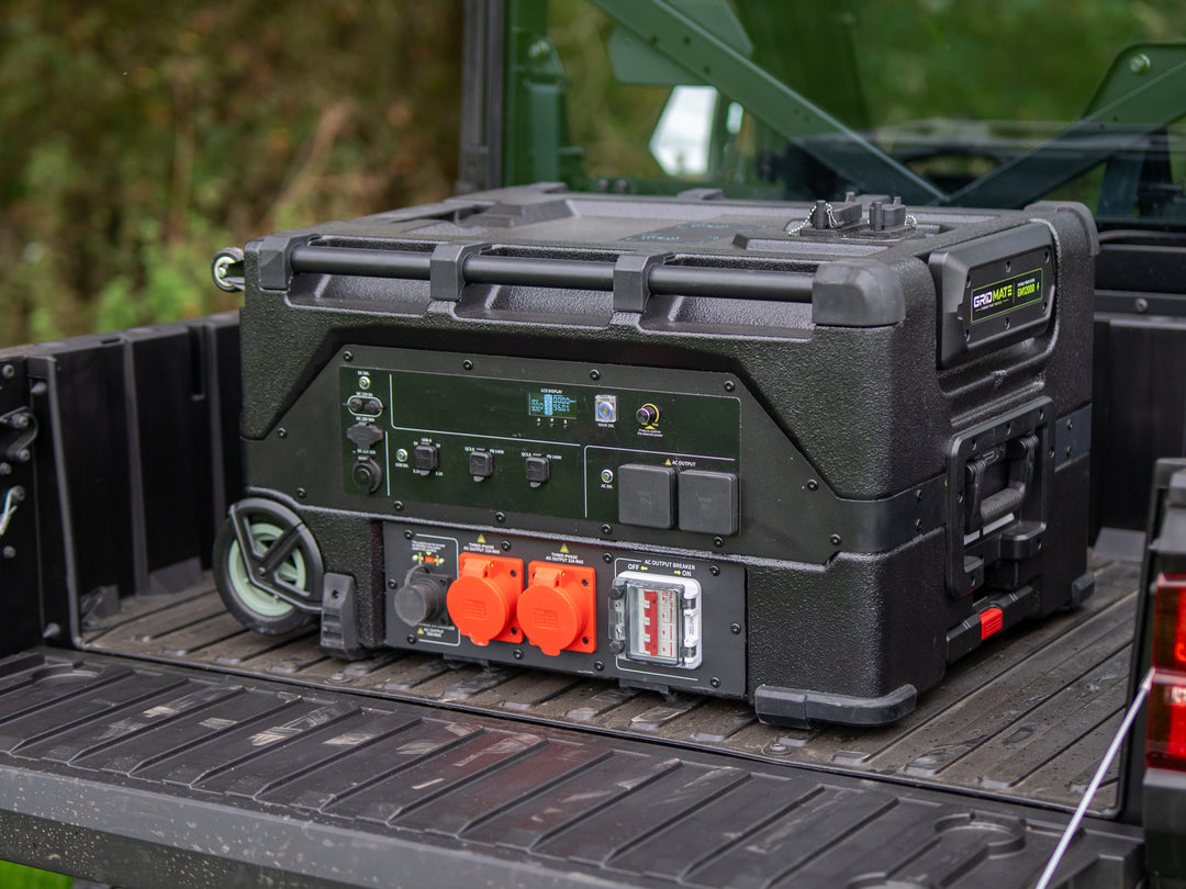 Grid Mate portable power station on a utility vehicle tailgate