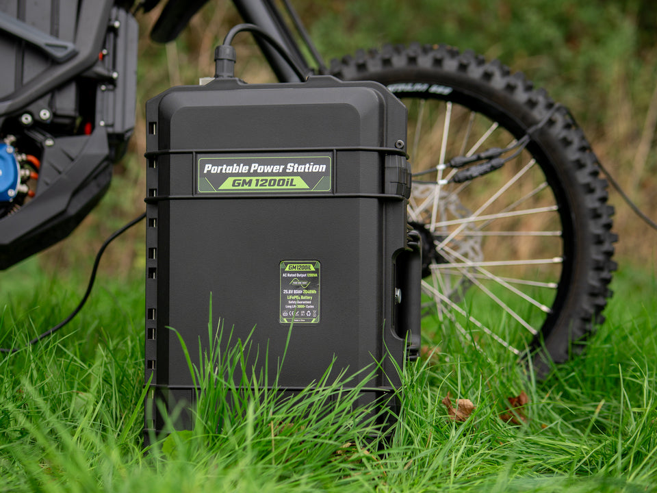 Grid Mate GM1200iL portable power station beside a motorbike wheel
